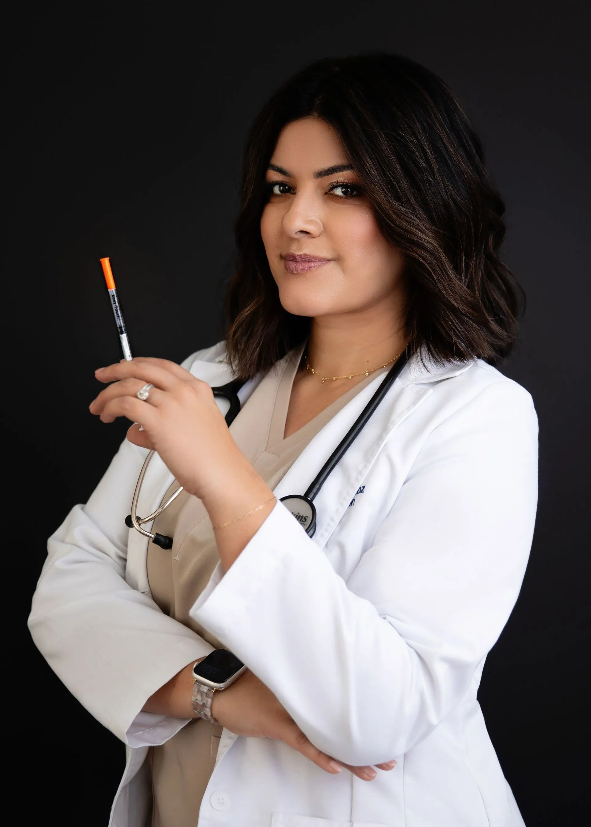 Paulina Munoz in a white clinical coat